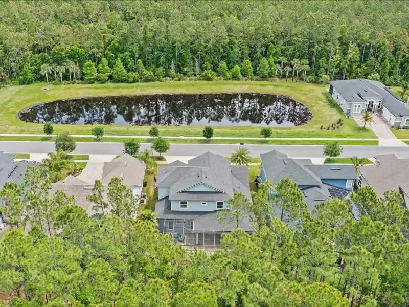 A RARE BLEND OF PRIVACY AND TRANQUILITY IN COASTAL OAKS, NOCATEE – image 2